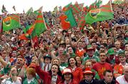 26 September 2004; Mayo fans cheer on their side during the game. Bank of Ireland All-Ireland Senior Football Championship Final, Kerry v Mayo, Croke Park, Dublin. Picture credit; Ray McManus / SPORTSFILE *** Local Caption *** Any photograph taken by SPORTSFILE during, or in connection with, the 2004 Bank of Ireland All-Ireland Senior Football Final which displays GAA logos or contains an image or part of an image of any GAA intellectual property, or, which contains images of a GAA player/players in their playing uniforms, may only be used for editorial and non-advertising purposes.  Use of photographs for advertising, as posters or for purchase separately is strictly prohibited unless prior written approval has been obtained from the Gaelic Athletic Association.