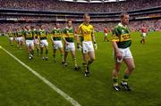 26 September 2004; The Kerry team led by Dara O Cinneide during the pre-match parade. Bank of Ireland All-Ireland Senior Football Championship Final, Kerry v Mayo, Croke Park, Dublin. Picture credit; Ray McManus / SPORTSFILE *** Local Caption *** Any photograph taken by SPORTSFILE during, or in connection with, the 2004 Bank of Ireland All-Ireland Senior Football Final which displays GAA logos or contains an image or part of an image of any GAA intellectual property, or, which contains images of a GAA player/players in their playing uniforms, may only be used for editorial and non-advertising purposes.  Use of photographs for advertising, as posters or for purchase separately is strictly prohibited unless prior written approval has been obtained from the Gaelic Athletic Association.