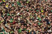 26 September 2004; Kerry fans watch the game despite the strong sunshine. Bank of Ireland All-Ireland Senior Football Championship Final, Kerry v Mayo, Croke Park, Dublin. Picture credit; Ray McManus / SPORTSFILE *** Local Caption *** Any photograph taken by SPORTSFILE during, or in connection with, the 2004 Bank of Ireland All-Ireland Senior Football Final which displays GAA logos or contains an image or part of an image of any GAA intellectual property, or, which contains images of a GAA player/players in their playing uniforms, may only be used for editorial and non-advertising purposes.  Use of photographs for advertising, as posters or for purchase separately is strictly prohibited unless prior written approval has been obtained from the Gaelic Athletic Association.