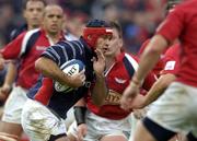 3 October 2004; Mike Mullins, Munster, makes a run at the Llanelli Scarlets defence. Celtic League 2004-2005, Munster v Llanelli Scarlets, Thomond Park, Limerick. Picture credit; Brendan Moran / SPORTSFILE