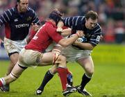 3 October 2004; John Kelly, Munster, supported by team-mate Mike Mullins, left, in action against Simon Easterby, Llanelli Scarlets. Celtic League 2004-2005, Munster v Llanelli Scarlets, Thomond Park, Limerick. Picture credit; Brendan Moran / SPORTSFILE