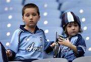 3 October 2004; Brothers Eoin, age 9, left, and Keelan Mac Cormaic, age 4, from Malahide, watch on during the game. TG4 Ladies Senior Football All-Ireland Final, Dublin v Galway, Croke Park, Dublin. Picture credit; Brian Lawless / SPORTSFILE