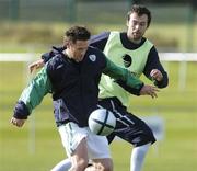 6 October 2004; Robbie Keane, Republic of Ireland, in action against team-mate Gary Breen during squad training. Malahide FC, Malahide, Co. Dublin. Picture credit; Brian Lawless / SPORTSFILE