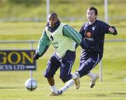 6 October 2004; Clinton Morrison, Republic of Ireland, in action against team-mate Gary Breen during squad training. Malahide FC, Malahide, Co. Dublin. Picture credit; Brian Lawless / SPORTSFILE