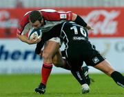 25 September 2004; Kevin Maggs, Ulster, is tackled by Gavin Henson, Neath-Swansea Ospreys. Celtic League 2004-2005, Ulster v Neath-Swansea Ospreys, Ravenhill, Belfast. Picture credit; Matt Browne / SPORTSFILE