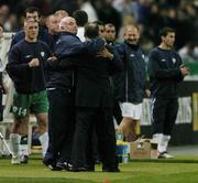 9 October 2004; Republic of Ireland manager Brian Kerr,  celebrates with assistant coach Noel O'Reilly, left, and coach Chris Hughton at the end of the game. FIFA World Cup 2006 Qualifier, France v Republic of Ireland, Stade de France, Paris, France. Picture credit; David Maher / SPORTSFILE