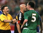 9 October 2004; Referee Dauden Ibanez steps in to seperate Andy O'Brien, Republic of Ireland, and Fabien Barthez, France. FIFA World Cup 2006 Qualifier, France v Republic of Ireland, Stade de France, Paris, France. Picture credit; David Maher / SPORTSFILE