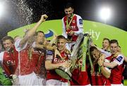 18 October 2013; St. Patrick’s Athletic captain Conor Kenna celebrates with the Airtricity League Premier Division Trophy alongside his team-mates. Airtricity League Premier Division, St. Patrick’s Athletic v Derry City, Richmond Park, Dublin. Picture credit: David Maher / SPORTSFILE