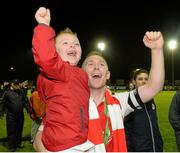 18 October 2013; St. Patrick’s Athletic captain Conor Kenna celebrates with his five year old son Callum after the game. Airtricity League Premier Division, St. Patrick’s Athletic v Derry City, Richmond Park, Dublin. Picture credit: Matt Browne / SPORTSFILE