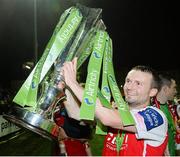 18 October 2013; St. Patrick’s Athletic's Conan Byrne celebrates with the Airtricity League Premier Division Trophy. Airtricity League Premier Division, St. Patrick’s Athletic v Derry City, Richmond Park, Dublin. Picture credit: Matt Browne / SPORTSFILE