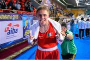 19 October 2013; Jason Quigley, Ireland, celebrates after being declared the winner over Vijender Singh Beniwal, India, after their Men's Middleweight 75Kg bout. AIBA World Boxing Championships Almaty 2013, Almaty, Kazakhstan. Photo by Sportsfile