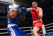 19 October 2013; Con Sheehan, Clonmel BC, Tipperary, representing Ireland, right, exchanges punches with Yohandi Ortega, Cuba, during their Men's Super Heavyweight +91Kg Last 32 bout. AIBA World Boxing Championships Almaty 2013, Almaty, Kazakhstan. Photo by Sportsfile