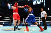 19 October 2013; Con Sheehan, Clonmel BC, Tipperary, representing Ireland, left, exchanges punches with Yohandi Ortega, Cuba, during their Men's Super Heavyweight +91Kg Last 32 bout. AIBA World Boxing Championships Almaty 2013, Almaty, Kazakhstan. Photo by Sportsfile