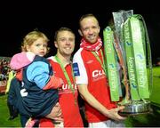 18 October 2013; Ger O'Brien, left, with his daughter Hannah, age 2, and Aidan Price, St. Patrick’s Athletic, celebrate at the end of the game. Airtricity League Premier Division, St. Patrick’s Athletic v Derry City, Richmond Park, Dublin. Picture credit: David Maher / SPORTSFILE