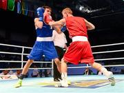 19 October 2013; Krisztian Nagy, Hungary, right, exchanges punches with  Michael Conlan, St John Bosco BC, Belfast, representing Ireland, during their Men's Bantamweight 56Kg Last 32 bout. AIBA World Boxing Championships Almaty 2013, Almaty, Kazakhstan. Picture credit: Paul Mohan / SPORTSFILE