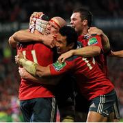 19 October 2013; Johne Murphy, 11, Munster, is congratulated by team-mates Paul O'Connell, Casey Laulala and captain Peter O'Mahony after scoring his side's second try. Heineken Cup 2013/14, Pool 6, Round 2, Munster v Gloucester, Thomond Park, Limerick. Picture credit: Ramsey Cardy / SPORTSFILE
