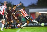 22 August 2025; Dipo Akinyemi of Derry City scores his side's first goal, under pressure from Killian Brouder of Galway United, during the SSE Airtricity Men's Premier Division match between Galway United and Derry City at Eamonn Deacy Park in Galway. Photo by Piaras Ó Mídheach/Sportsfile