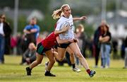 26 August 2025; Caoimhne O'Mahony of Midlands on her way to scoring her side's third try despite the tackle of Anna Cosgrove of North East during the BearingPoint Sarah Robinson Cup Round 1 match between Midlands and North East at SETU in Carlow. Photo by Ben McShane/Sportsfile