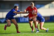 30 August 2025; Aoife Corey of Munster in action against Clara Dunne, right, and Katie Corrigan of Leinster during the Vodafone Women’s Interprovincial Championship final match between Leinster and Munster at Energia Park in Dublin. Photo by Tyler Miller/Sportsfile