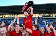 30 August 2025; Maeve Óg O'Leary of Munster, centre, celebrates with team-mates and the cup after the Vodafone Women’s Interprovincial Championship final match between Leinster and Munster at Energia Park in Dublin. Photo by Tyler Miller/Sportsfile