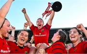 30 August 2025; Maeve Óg O'Leary of Munster, centre, celebrates with team-mates and the cup after the Vodafone Women’s Interprovincial Championship final match between Leinster and Munster at Energia Park in Dublin. Photo by Tyler Miller/Sportsfile
