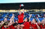 30 August 2025; Maeve Óg O'Leary of Munster, centre, celebrates with team-mates and the cup after the Vodafone Women’s Interprovincial Championship final match between Leinster and Munster at Energia Park in Dublin. Photo by Tyler Miller/Sportsfile
