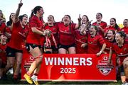 30 August 2025; Maeve Óg O'Leary of Munster, centre, celebrates with team-mates and the cup after the Vodafone Women’s Interprovincial Championship final match between Leinster and Munster at Energia Park in Dublin. Photo by Tyler Miller/Sportsfile Photo by Tyler Miller/Sportsfile