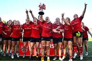 30 August 2025; Maeve Óg O'Leary of Munster, centre, celebrates with team-mates and the cup after the Vodafone Women’s Interprovincial Championship final match between Leinster and Munster at Energia Park in Dublin. Photo by Tyler Miller/Sportsfile Photo by Tyler Miller/Sportsfile