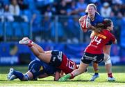 30 August 2025; Clara Dunne of Leinster is tackled by Alana McInerney of Munster during the Vodafone Women’s Interprovincial Championship final match between Leinster and Munster at Energia Park in Dublin. Photo by Shauna Clinton/Sportsfile