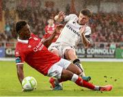 30 August 2025; Adam McDonnell of Bohemians is tackled by Edwin Agbaje of Sligo Rovers during the SSE Airtricity Men's Premier Division match between Sligo Rovers and Bohemians at The Showgrounds in Sligo. Photo by Thomas Flinkow/Sportsfile