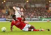 30 August 2025; Adam McDonnell of Bohemians is tackled by Edwin Agbaje of Sligo Rovers during the SSE Airtricity Men's Premier Division match between Sligo Rovers and Bohemians at The Showgrounds in Sligo. Photo by Thomas Flinkow/Sportsfile