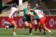 31 August 2025; Stacey Flood of Ireland is tackled by Clara Piquero, left, and Amalia Argudo of Spain during the Women's Rugby World Cup 2025 Pool C match between Ireland and Spain at Franklin's Gardens in Northampton, England. Photo by Harry Murphy/Sportsfile