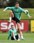 5 September 2025; Kasey McAteer and Josh Cullen, seated, during a Republic of Ireland training session at the FAI National Training Centre in Abbotstown, Dublin. Photo by Stephen McCarthy/Sportsfile
