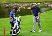 5 September 2025; Shane Lowry of Ireland takes a club from his caddie Darren Reynolds on the 15th fairway during day two of the Amgen Irish Open Golf Championship 2025 at The K Club in Straffan, Kildare. Photo by Ramsey Cardy/Sportsfile