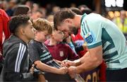 5 September 2025; Alex Nankivell of Munster signs autoraphs after the pre-season friendly match between Gloucester and Munster at Kingsholm Stadium in Gloucester, England. Photo by Patrick Khachfe/Sportsfile