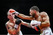 5 September 2025; Senan Kelly, left, and Ben Marksby in action during their super lightweight bout at the 3 Arena in Dublin. Photo by David Fitzgerald/Sportsfile