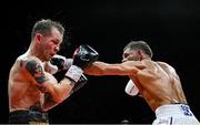 5 September 2025; Ben Marksby, right, and Senan Kelly in action during their super lightweight bout at the 3 Arena in Dublin. Photo by David Fitzgerald/Sportsfile