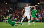 6 September 2025; Attila Szalai of Hungary is tackled by Josh Cullen of Republic of Ireland during the FIFA World Cup 2026 Group F qualifying match between Republic of Ireland and Hungary at the Aviva Stadium in Dublin. Photo by David Fitzgerald/Sportsfile
