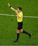 6 September 2025; Referee Harm Osmer shows a yellow card to Dominik Szoboszlai of Hungary, not pictured, during the FIFA World Cup 2026 Group F qualifying match between Republic of Ireland and Hungary at the Aviva Stadium in Dublin. Photo by Piaras Ó Mídheach/Sportsfile