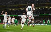 6 September 2025; Roland Sallai of Hungary celebrates with teammate Dominik Szoboszlai, 10, after scoring their side's second goal during the FIFA World Cup 2026 Group F qualifying match between Republic of Ireland and Hungary at the Aviva Stadium in Dublin. Photo by Ben McShane/Sportsfile