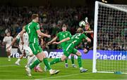 6 September 2025; Nathan Collins of Republic of Ireland heads the ball goalwards during the FIFA World Cup 2026 Group F qualifying match between Republic of Ireland and Hungary at the Aviva Stadium in Dublin. Photo by Stephen McCarthy/Sportsfile