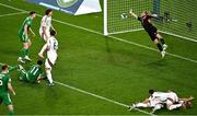 6 September 2025; Hungary goalkeeper Dénes Dibusz saves a header by Finn Azaz of Republic of Ireland during the FIFA World Cup 2026 Group F qualifying match between Republic of Ireland and Hungary at the Aviva Stadium in Dublin. Photo by Piaras Ó Mídheach/Sportsfile