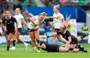 7 September 2025; Aoife Dalton of Ireland is tackled by Georgia Ponsonby, centre, and Jorja Miller of New Zealand during the Women's Rugby World Cup 2025 Pool C match between New Zealand and Ireland at Brighton and Hove Community Stadium in Falmer, England. Photo by Harry Murphy/Sportsfile
