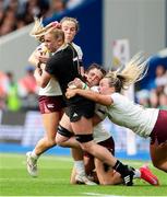7 September 2025; Jorja Miller of New Zealand is tackled by Ireland players Aoibheann Reilly, Amee Leigh Costigan and Aoife Dalton during the Women's Rugby World Cup 2025 Pool C match between New Zealand and Ireland at Brighton and Hove Community Stadium in Falmer, England. Photo by Harry Murphy/Sportsfile