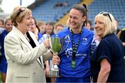 7 September 2025; Waterford captain Lisa Dower, centre, is presented with the Angela Heart Memorial Cup by Victoria, left, and Ebbie Heart after the FAI Women’s Angela Hearst Inter-League Cup final match between Waterford Women's & Schoolgirls League and Wexford District Women’s & Schoolgirls League at the Regional Sports Centre in Waterford. Photo by Shauna Clinton/Sportsfile