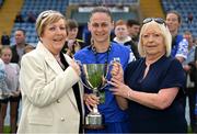 7 September 2025; Waterford captain Lisa Dower, centre, is presented with the Angela Heart Memorial Cup by Victoria, left, and Ebbie Heart after the FAI Women’s Angela Hearst Inter-League Cup final match between Waterford Women's & Schoolgirls League and Wexford District Women’s & Schoolgirls League at the Regional Sports Centre in Waterford. Photo by Shauna Clinton/Sportsfile