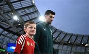 6 September 2025; Finn Azaz of Republic of Ireland and his mascot walk out for the FIFA World Cup 2026 Group F qualifying match between Republic of Ireland and Hungary at the Aviva Stadium in Dublin. Photo by Stephen McCarthy/Sportsfile