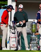 7 September 2025; Stuart Grehan of Great Britain and Ireland, right, talks to Jacob Modleski of USA during day two of the 50th Walker Cup at Cypress Point Club in California, USA. Photo by Brian Spurlock/Sportsfile