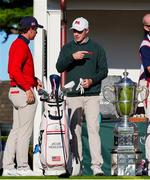 7 September 2025; Stuart Grehan of Great Britain and Ireland, right, talks to Jacob Modleski of USA during day two of the 50th Walker Cup at Cypress Point Club in California, USA. Photo by Brian Spurlock/Sportsfile