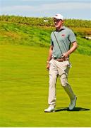 7 September 2025; Stuart Grehan of Great Britain and Ireland reacts to chipping the ball in from off the green on the 16th hole during day two of the 50th Walker Cup at Cypress Point Club in California, USA. Photo by Brian Spurlock/Sportsfile